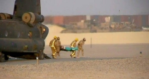 Video grabbed image of a casualty arriving at a hospital in Helmand Province, Afghanistan, after five British soldiers were shot dead in an attack.