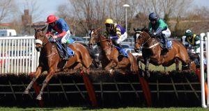 AYR WE GO: Ballybogey (Ruby Walsh, left) on his way to victory in the West Sound Novices' Hurdle  at Ayr yesterday: Picture: Anna Gowthorpe/PA Wire
