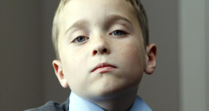 Brendan Shannon, 8, at his home, after he found a pipe bomb lying in the playground at his school, St Comgall