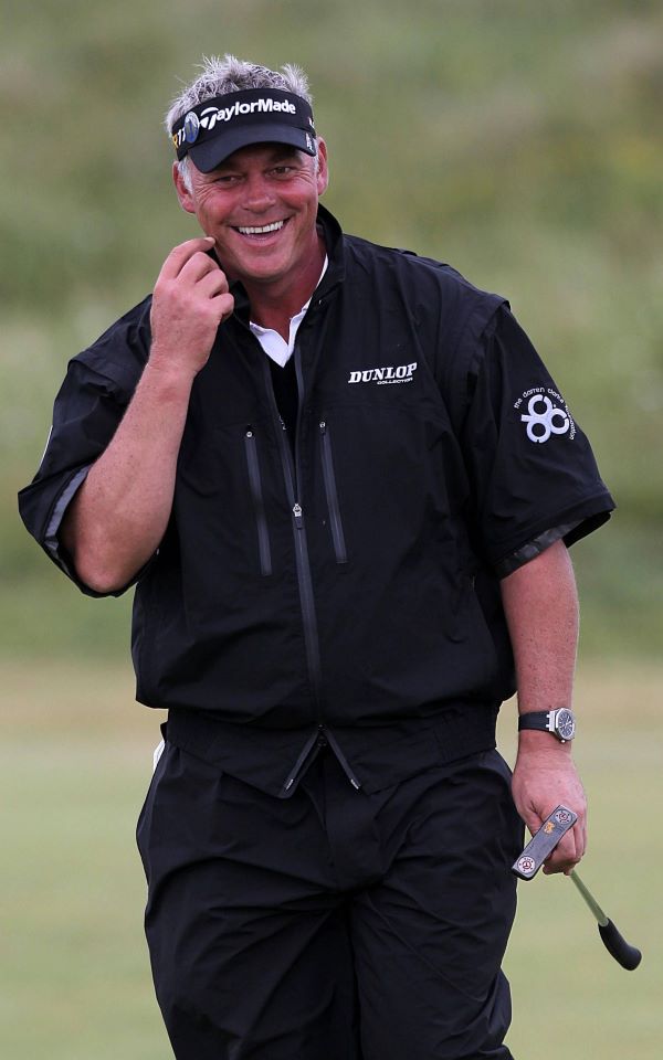 Darren Clarke grins for Ireland as he wins the British Open.