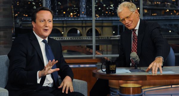 David Cameron (left) talks with talk show host David Letterman on the David Letterman Show in New York