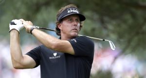 Mickelson tees off on the eighth during the first round of the U.S. Open at Merion (AP Photo/Julio Cortez)