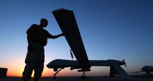 A US military crew chief completes a post-flight inspection of the RQ-1 Predator drone in Balad Air Base, Iraq.  Picture: Rob Jensen/USAF via Getty Images