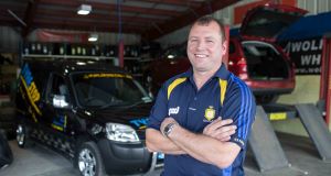 BACK TO THE DAY JOB: Former Clare footballer Martin Daly at his Tyre Stop business in Ennis.   Picture: Eamon Ward