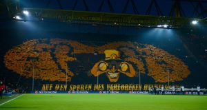 Borussia Dortmund fans make a large mosaic ahead of their clash with Malaga in the Champions League quarter-finals last month. Picture: Dennis Grombkowski/Bongarts/Getty Images