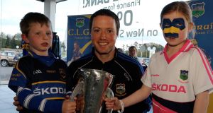 STARS IN THEIR EYES: At the Tipperary GAA meet and greet session last night in the Ryan Motors Skoda dealers in Clonmel was Conor O'Brien (centre) with fans, Rory Whelan (5) and Alanagh Blackwell (8) from Carrick On Suir. Picture: Mary Browne