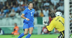 Fabio Grosso beats Dimitar Ivankov to score his sides first goal.