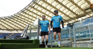 Jamie Heaslip and Rob Kearney make their way onto the pitch for the Captain's Run at the Stadio Olimpico in Rome. Picture: Brendan Moran/Sportsfile 