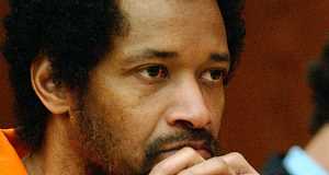 John Allen Muhammad listens to evidence on March 9, 2004, prior to being sentenced for the shooting of Dean Meyers.