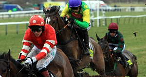 Kauto Star ridden by Ruby Walsh during the early stages of the Totesport Cheltenham Gold Cup Steeple Chase at the 2010 Cheltenham Festival today. Pic: PA