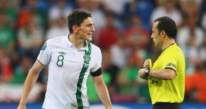 Keith Andrews is shown a red card by Cuneyt Cakir during Ireland's Euro 2012 clash with Italy. Picture: Christof Koepsel