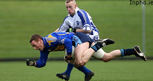 Paul Johnson of Moyle Rovers tackles Barry John Keane of Kerins ORahillys. Pic: Inpho