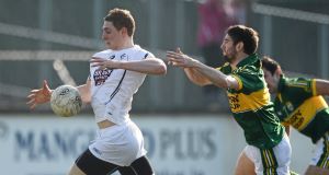 ON A SURGE: Kildare's Daniel Flynn bursts clear of Kerry's Killian Young in last weekend's Allianz FL Division 1 game at St Conleth's Park, Newbridge. Picture: David Maher/Sportsfile