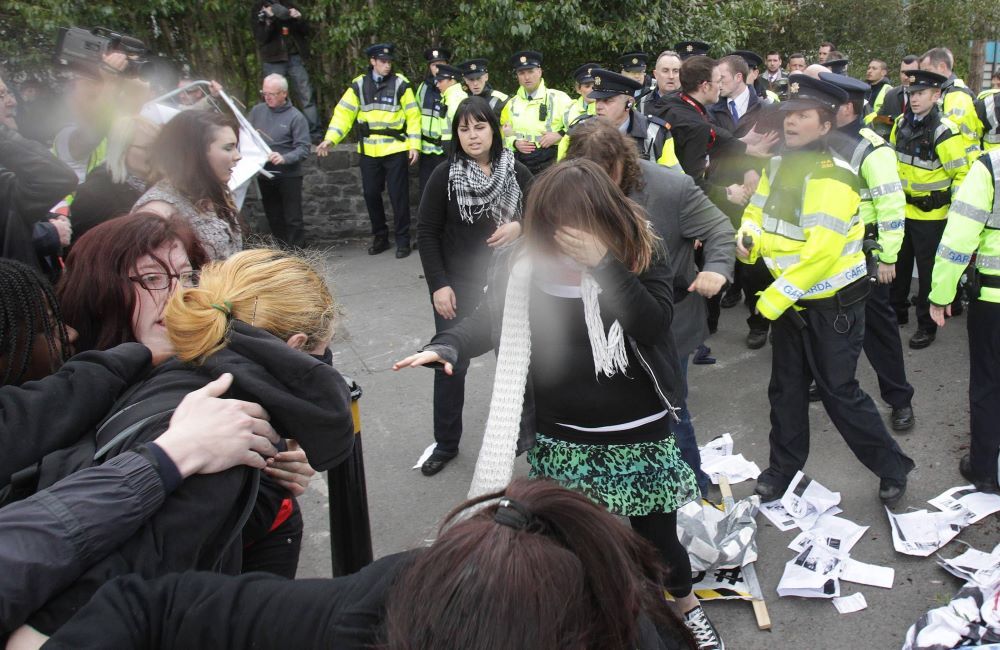 Gardai use pepper spray as they clash with anti-austerity protesters today.