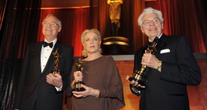 Filmmaker Roger Corman, left, actress Lauren Bacall, centre, and cinematographer Gordon Willis pose with their honorary Oscars .