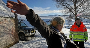 John Moriarty, Dublin Civil Defence Commanding officer, speaks with Lisa Ni Dhomhnaill outside her remote homestead in the Cloughlea Mountain Region in Co. Wicklow today. Pic: PA