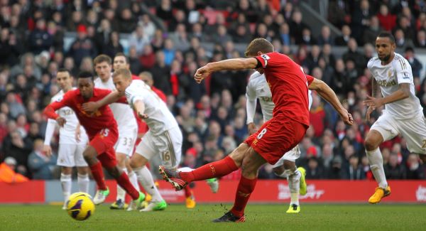 Gerrard slots in the first from the spot.Picture: PA