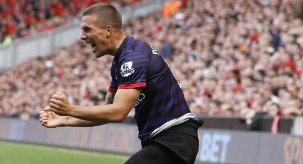 Arsenal's Lukas Podolski celebrates his goal today. Picture: PA