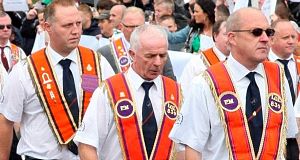 A controversial Orange Order parade passed off peacefully in Belfast today, but a senior official called for talks to end the deadlock over future marches.
