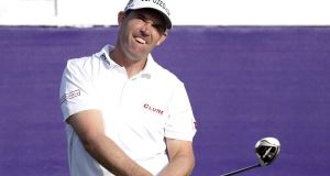 adraig Harrington watches his drive on the 10th tee during the opening round of the St. Jude Classic in Memphis. (AP Photo/Rogelio V. Solis)
