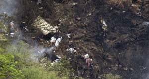 Pakistani rescue workers look for survivors at the site of the crash.