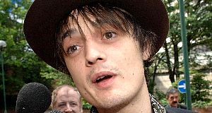 The manager of rock star Pete Doherty was today charged in connection with a hit-and-run crash, police said.