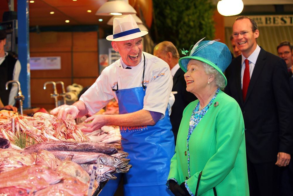 Her Majesty Queen Elizabeth II meets fishmonger Pat O'Connell in Cork’s English Market.