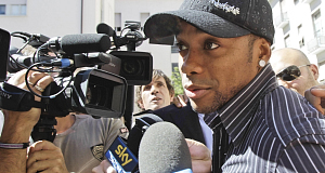 Robinho mobbed by the media in Milan earlier today.