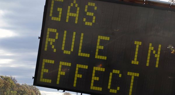A sign is seen on the Garden State Parkway near Woodbridge, New Jersey, after a gas rationing system ordered by Gov. Chris Christie went into effect.