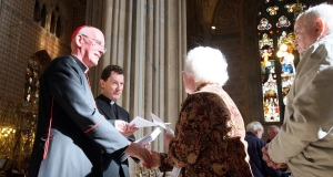 Cardinal Sean Brady, Primate of all Ireland, gives out the pastoral letter to parishioners at St Patrick