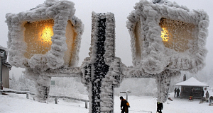 Two lamps shine on top of the Feldberg mountain near Frankfurt, central Germany, yesterday following a heavy snow storm. Pic: AP