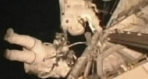 In this image taken from video, space shuttle Atlantis crewmen Michael Foreman and Dr Robert Satcher, Jr, install a space antenna outside the International Space Station. In this image taken from video, space shuttle Atlantis crewmen Michael Foreman and Dr Robert Satcher, Jr, install a space antenna outside the International Space Station.