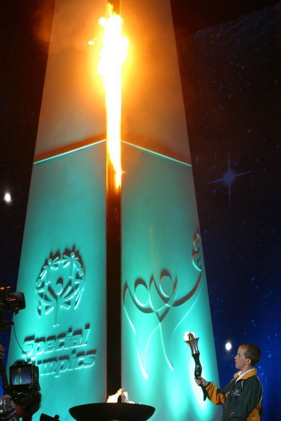 Special Olympics athlete David McCauley lights the Olympic Torch during the opening ceremony of the 2003 Special Olympics World Games at Croke Park.