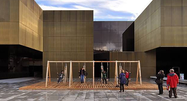 Oporto- and Berlin-based collective Moradavaga built this installation, titled Swing, outside the brass walls of the International Centre for the Arts Jose de Guimarães.