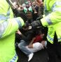 Protesters clash with police outside the Syrian Embassy in central London today.