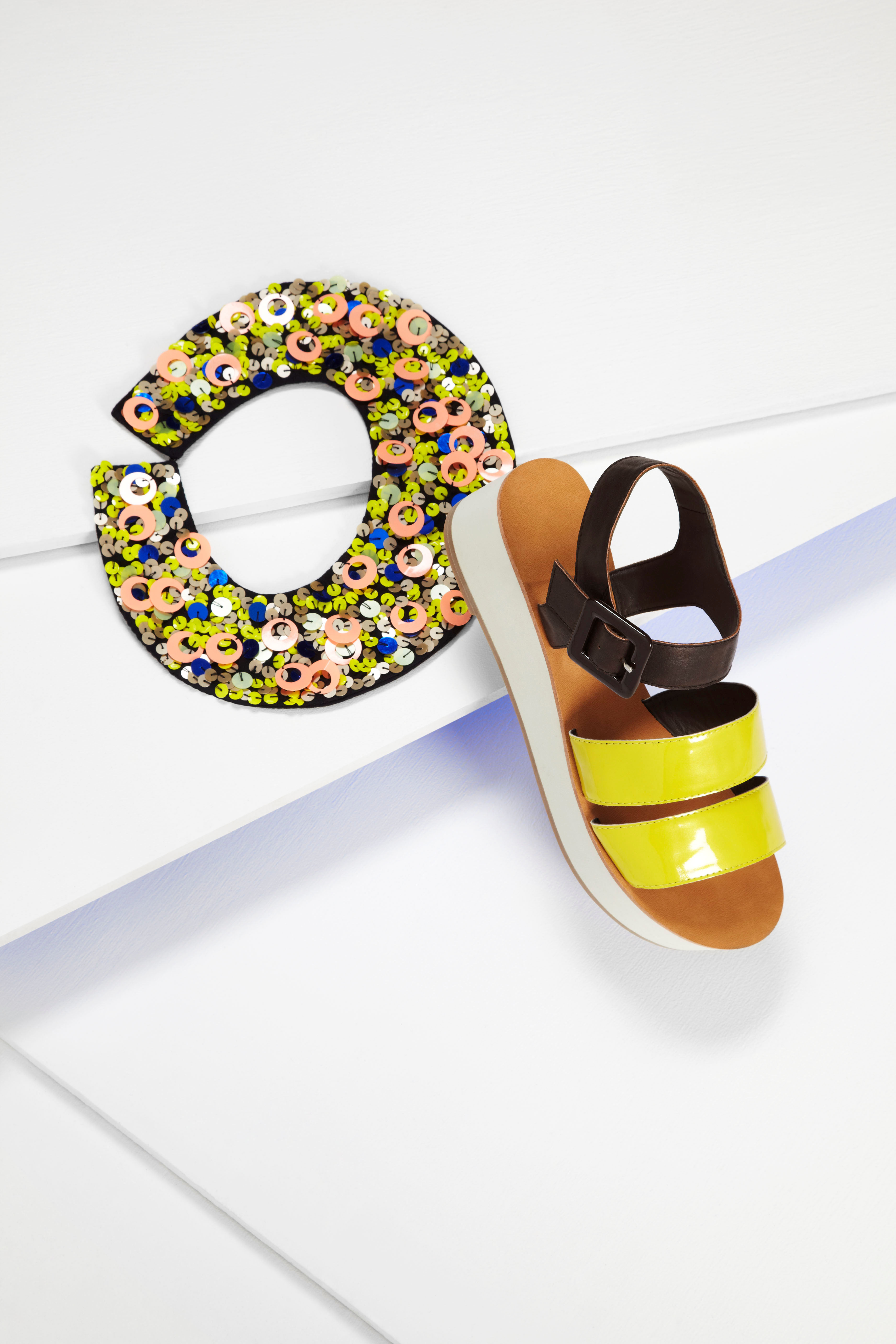 Asos Vinnie flatforms with thick straps €54.30; Asos fluro sequin collar €20.36