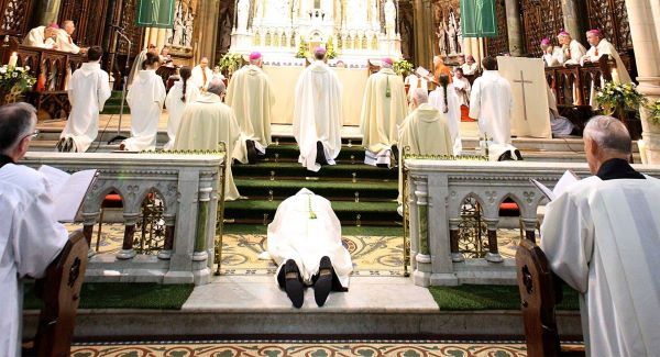 Canon William Crean prostrated before the alter of St Colman's Cathedral, Cobh as he was ordained the 67th Bishop of Cloyne today. Picture: Denis Hyland Photography
