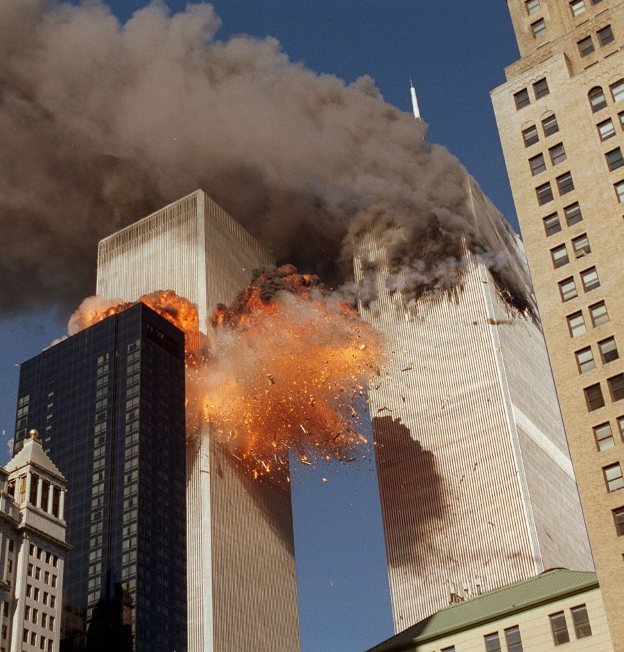 Smoke billows from one of the World Trade Centre towers and flames and debris explode from the second. Picture: Chao Soi Cheong/AP